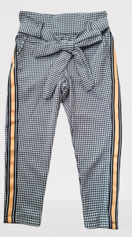 Elegantly sports a shepherd's Plaid pants with decorative tape and bow